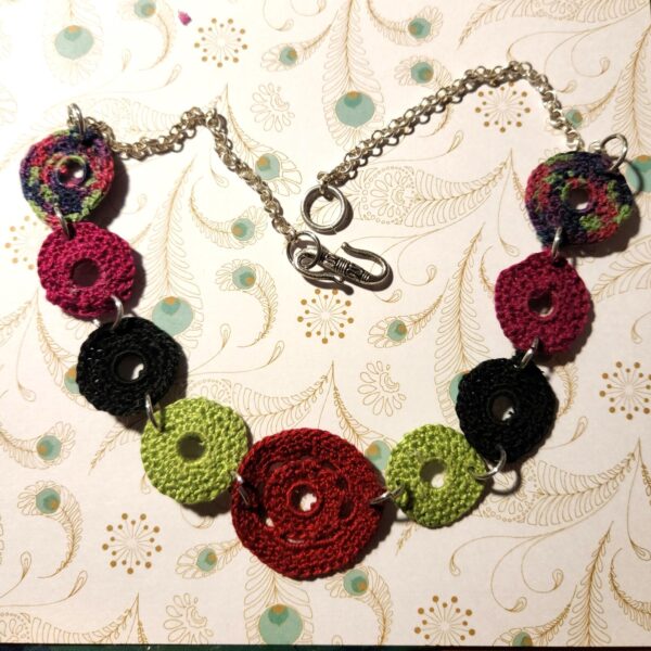Micro-crochet 5 color disc necklace with silver chain and silver hook.